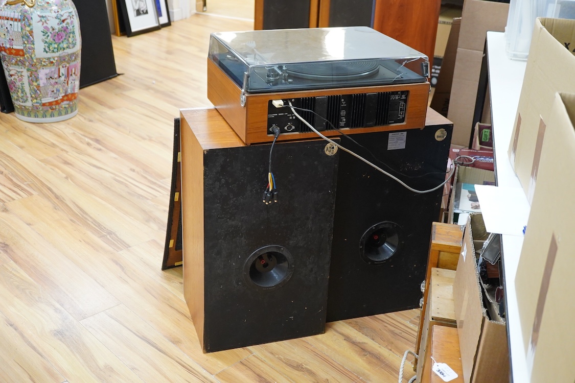 A Dynatron Goldring GL78 turntable with integral amplifier and tuner, made in Switzerland, together with a pair of Leak Sandwich 600 stereo speakers in teak cabinets, 65cm high